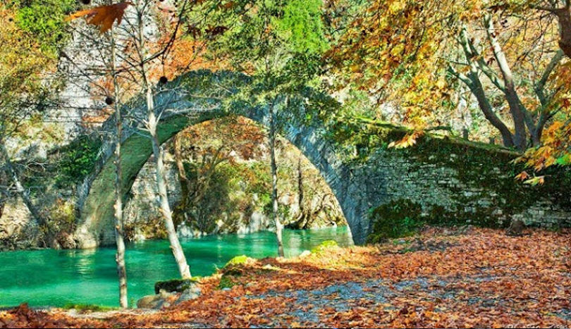  Scenic mountain roads and arched stone bridges connect villages filled with guesthouses and cafes around the Aristi Mountains.